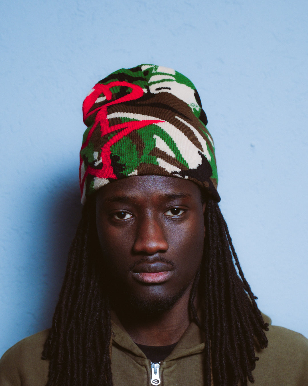 Model wearing elstar dawn DPM camo beanie, reversible rib knit, one size