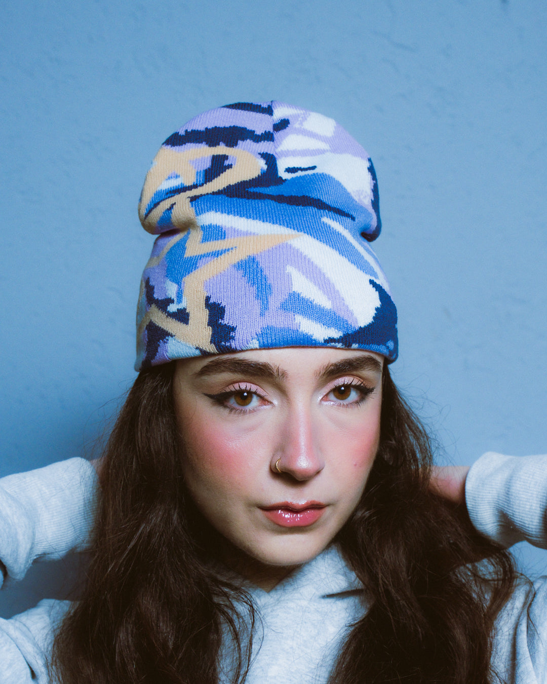 Model wearing elstar dawn DPM camo beanie, reversible rib knit, one size